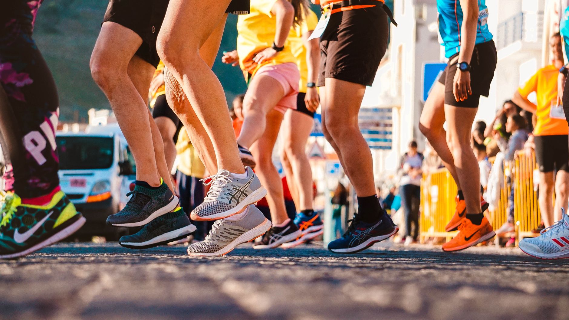 running shoes display in sports store, beginner looking at options